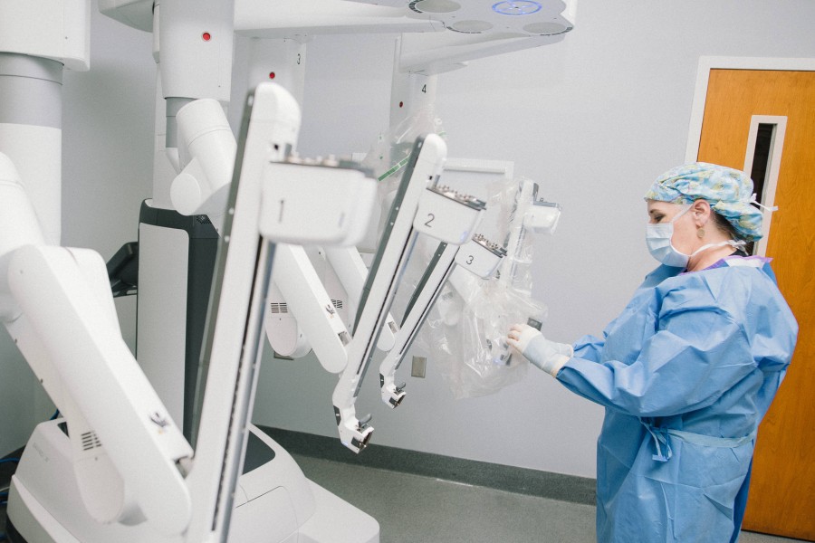 Surgery Nurse Preparing Surgical Robot